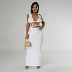Detailed view of white textured lace two-piece set with tie-up halter top and maxi skirt