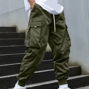 Detailed view of olive green loose cargo pants with multi-pockets and ribbed cuffs.