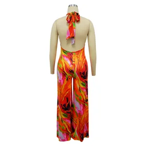 Back view of vibrant floral print halter neck backless jumpsuit for women in colorful style
