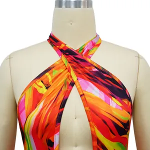 Detailed view of the vibrant multi-color abstract print on a halter neck jumpsuit bodice.