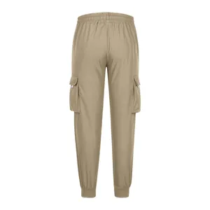 Detail view from the back of khaki men's cargo joggers featuring side pockets and elastic waist