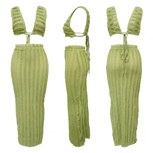 Multi-angle views of green textured two-piece set with sleeveless top and long skirt