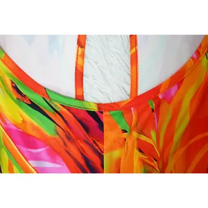 Detailed macro view of colorful printed halter jumpsuit stitching and neck strap