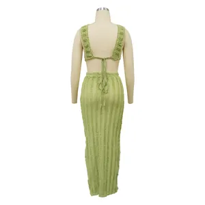 Back view detail of a light green textured sleeveless lace skirt set on a mannequin.