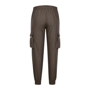 Detail back view of men's loose brown cargo jogger pants featuring side utility pockets
