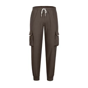 Front view of dark brown men's cargo joggers with multiple pockets and drawstring