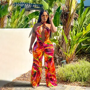 Full view of a vibrant printed halter neck backless wide-leg jumpsuit on a model