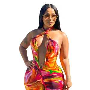 Vibrant printed halter neck jumpsuit with deep V-neckline and open back design.