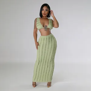 Sleeveless backless green textured crop top and matching long skirt two-piece set for women