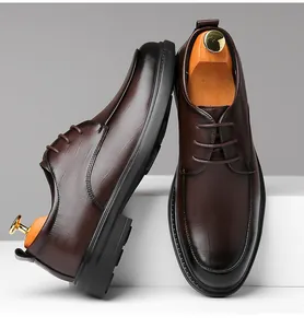 Detailed view of brown men's business leather shoes with soft soles and fine texture.