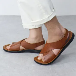 Side view of men's brown leather Roman sandals with cross straps and soft sole