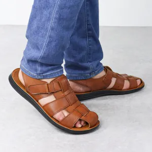 Close-up of men's brown Roman leather sandals with adjustable straps and soft sole