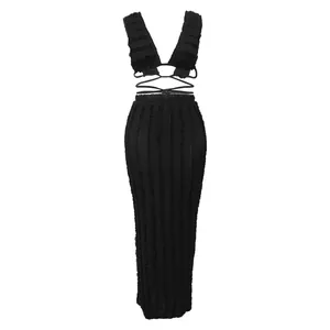 Detailed view of black textured lace sleeveless backless crop top and maxi skirt set