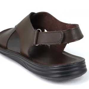 Detailed view of the adjustable brown leather heel strap on breathable men's sandals