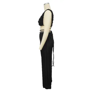 Detailed side view of black textured lace two-piece set with backless top and pants