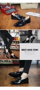 Detailed view of men's black tassel loafers with retro pointed toe in British style