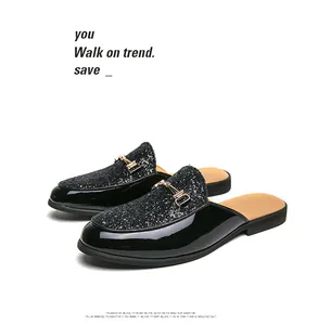 Detailed view of stylish men's backless loafers with glitter finish and gold horsebit