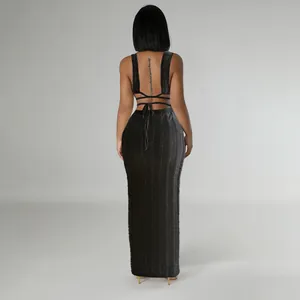 Detailed back view of a sexy black sleeveless backless lace maxi dress with tie straps.