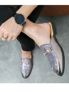 Macro detail of men's casual mules featuring silver glitter and metallic mirror finish