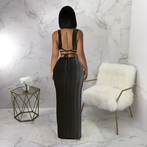 Back view of an elegant black sleeveless lace maxi dress with tie-up backless detail