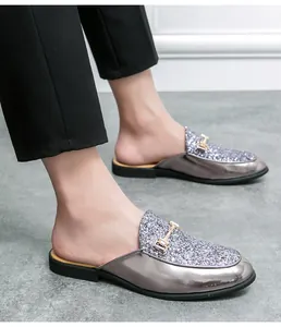 Detail view of men's silver metallic backless loafers with glitter vamp and buckle