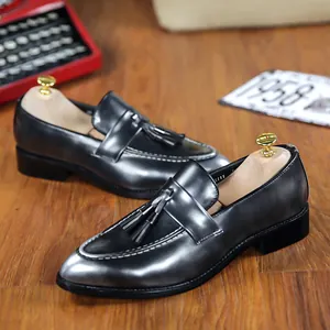 Vintage men's British style tassel loafers with a metallic grey finish and elegant pointed toe design