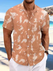 Close-up detail of men's orange tie-dye short-sleeved beach shirt with linen texture