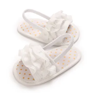 Comfortable white baby girl sandals with ruffles and yellow polka dot patterned insoles