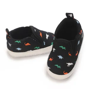 Detailed top view of black baby canvas pre-walker shoes featuring colorful dinosaur prints