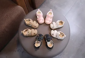 Variety of breathable closed-toe hollow-out baby sandals in pink, beige, black and cream.