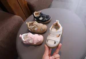 Detail shot of breathable summer baby hollow sandals in various soft color options