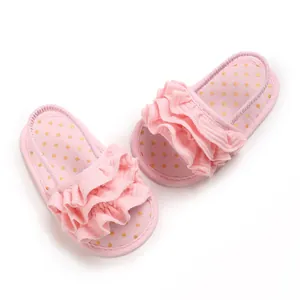 Detailed close-up showing pink breathable baby girl sandals with elegant ruffles