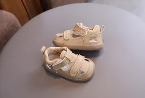 Detailed macro view of retro breathable toddler sandals with hollow design and velcro