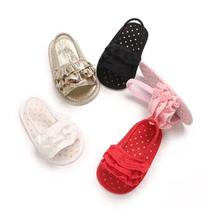Variety of ruffled baby girl sandals in gold, red, black, pink, and white for summer