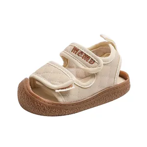 Beige toddler closed-toe beach sandals with soft non-slip soles and quilted Velcro straps.