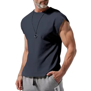 Detailed view showing the fit and cut of a men's casual sleeveless tank top in dark grey