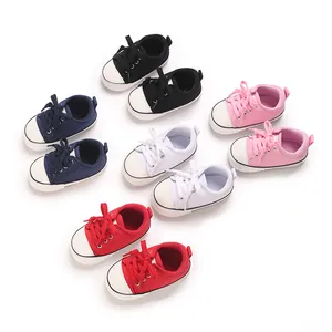 Selection of colorful infant canvas sneakers for baby boys and girls in multiple shades