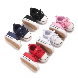 Assorted colorful baby canvas sneakers for 0-1 year old infants shown in a variety of shades