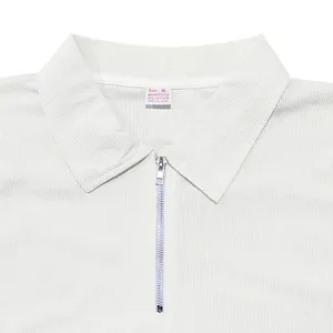 Detailed close-up of a white men's zip-up polo shirt collar showing fine fabric texture
