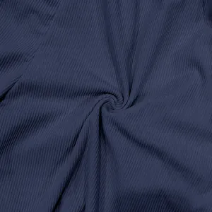 Detailed macro shot of navy blue ribbed corduroy fabric for men's casual shorts