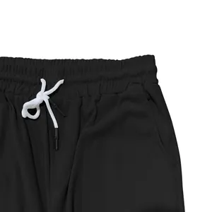 Vue détaillée d'un pantalon en velours côtelé noir, taille et cordon de serrage