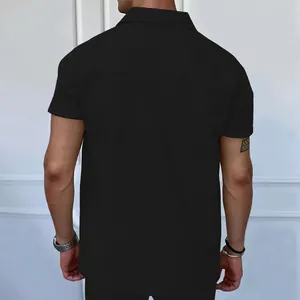 Back view showing the texture and fit of the black short sleeve Polo shirt.
