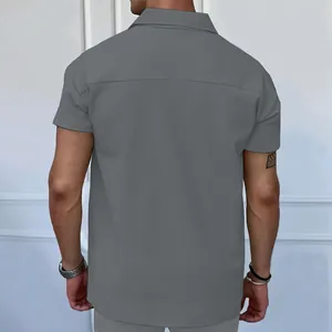 Back view of grey short-sleeved polo shirt with vertical striped texture details