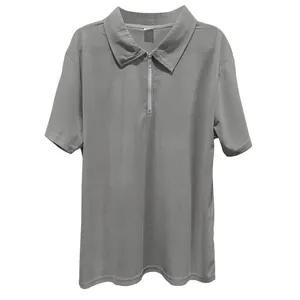 Detailed macro view of gray ribbed fabric and front zipper on men's short sleeve polo shirt