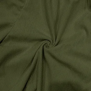 Detailed macro view of olive green corduroy fabric showing the fine vertical rib texture