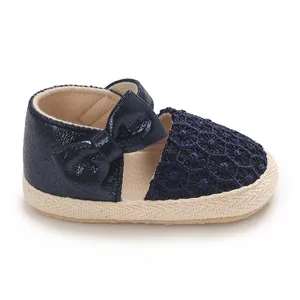 Charming navy blue baby girl princess shoes featuring glittery bow and delicate floral lace