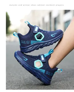 Blue breathable mesh boys' running shoes shown being worn outdoors on the street