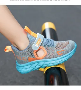 Detail of breathable mesh boys' sports sneaker with soft sole and velcro strap.