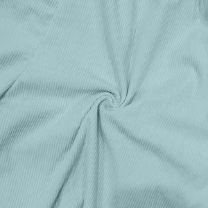 Macro close-up detail of light blue ribbed corduroy fabric texture for summer shorts.