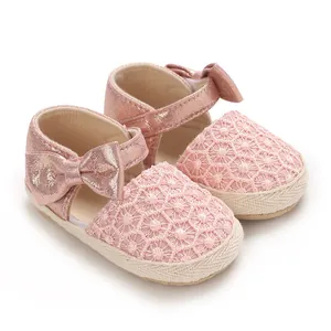Cute pink baby girl princess shoes with floral lace pattern and bow decoration
